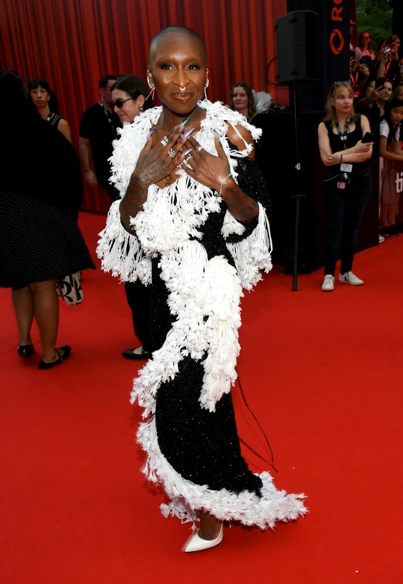 Cynthia Erivo posing on the red carpet with her signature buzz cut