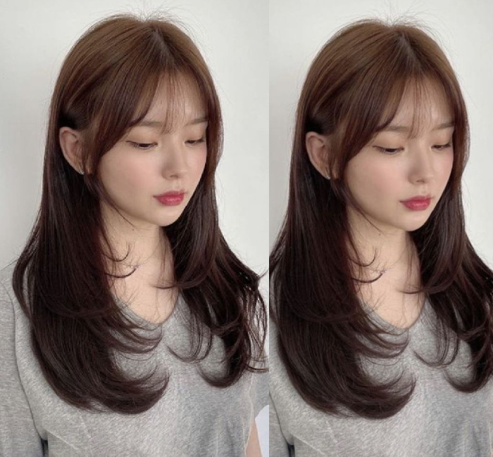 Medium layered hair with a Korean C-curl perm and feathered wispy bangs