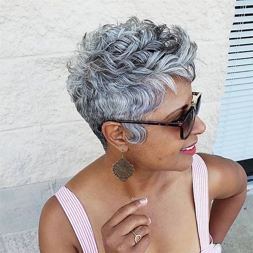 Curly tapered silver pixie cut on a Black woman over 50