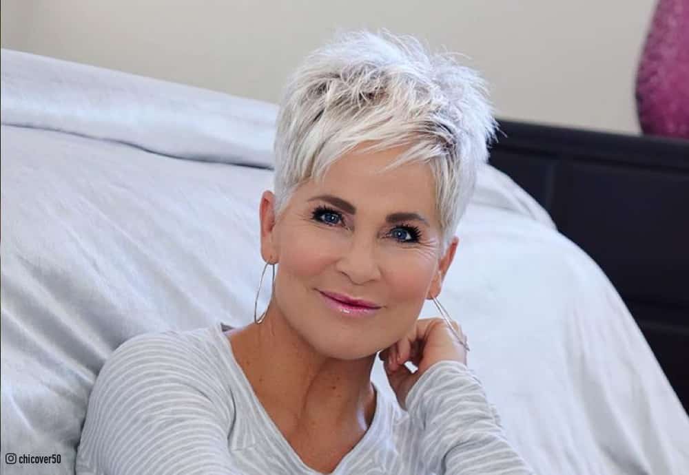 Soft pearl gray French crop pixie haircut on a woman over 50