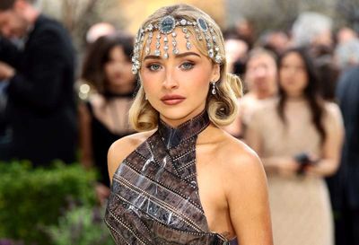 Sabrina Carpenter wearing a blonde vintage bob with a crystal headpiece
