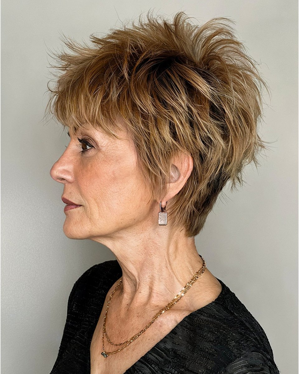 Voluminous crown shaggy bronde pixie cut side profile on a woman over 50