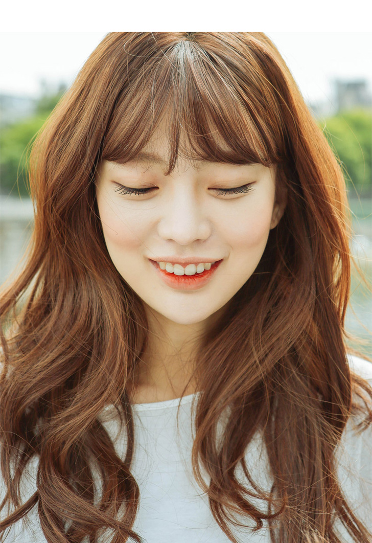 Warm caramel brown wavy hair with soft Korean wispy bangs