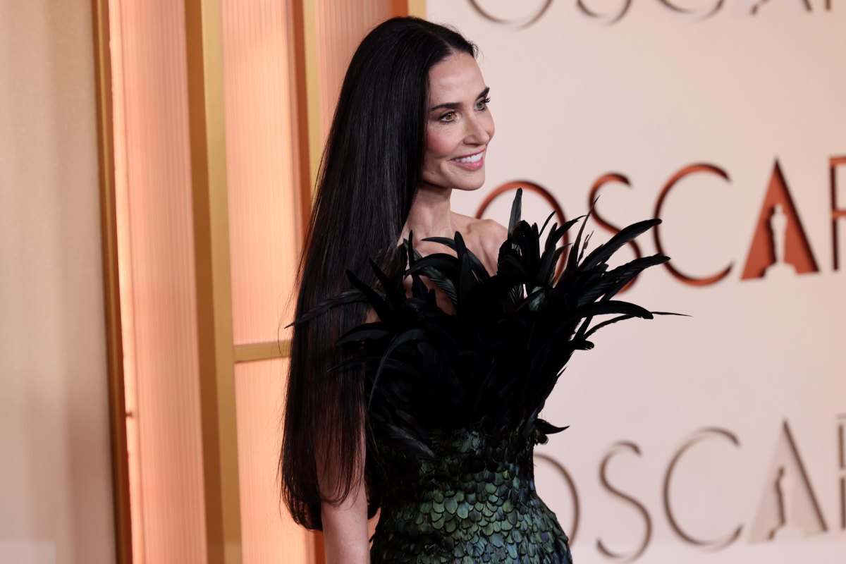 Demi Moore with ultra-long, glossy straight dark hair at the Oscars