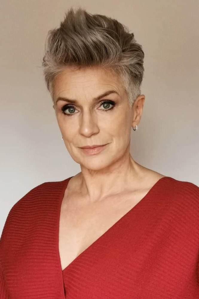 Platinum silver pixie cut with lifted quiff on a mature woman