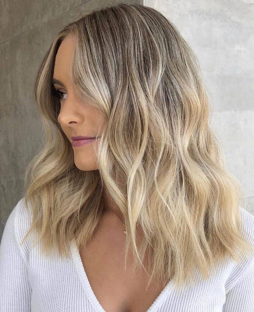 Classic Blonde Balayage with Curtain Bangs